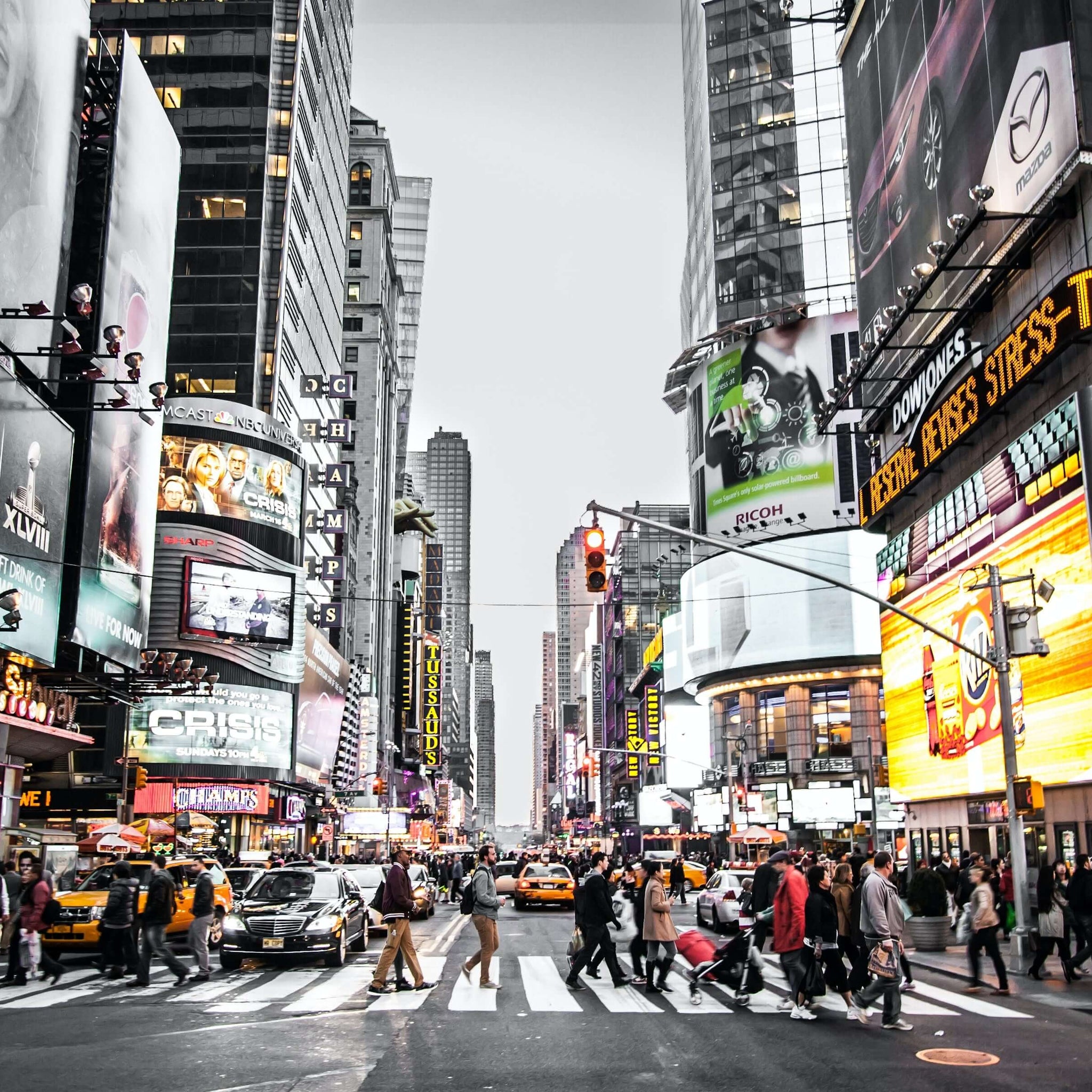 A shot of Times Square in New York City during the day, busy.