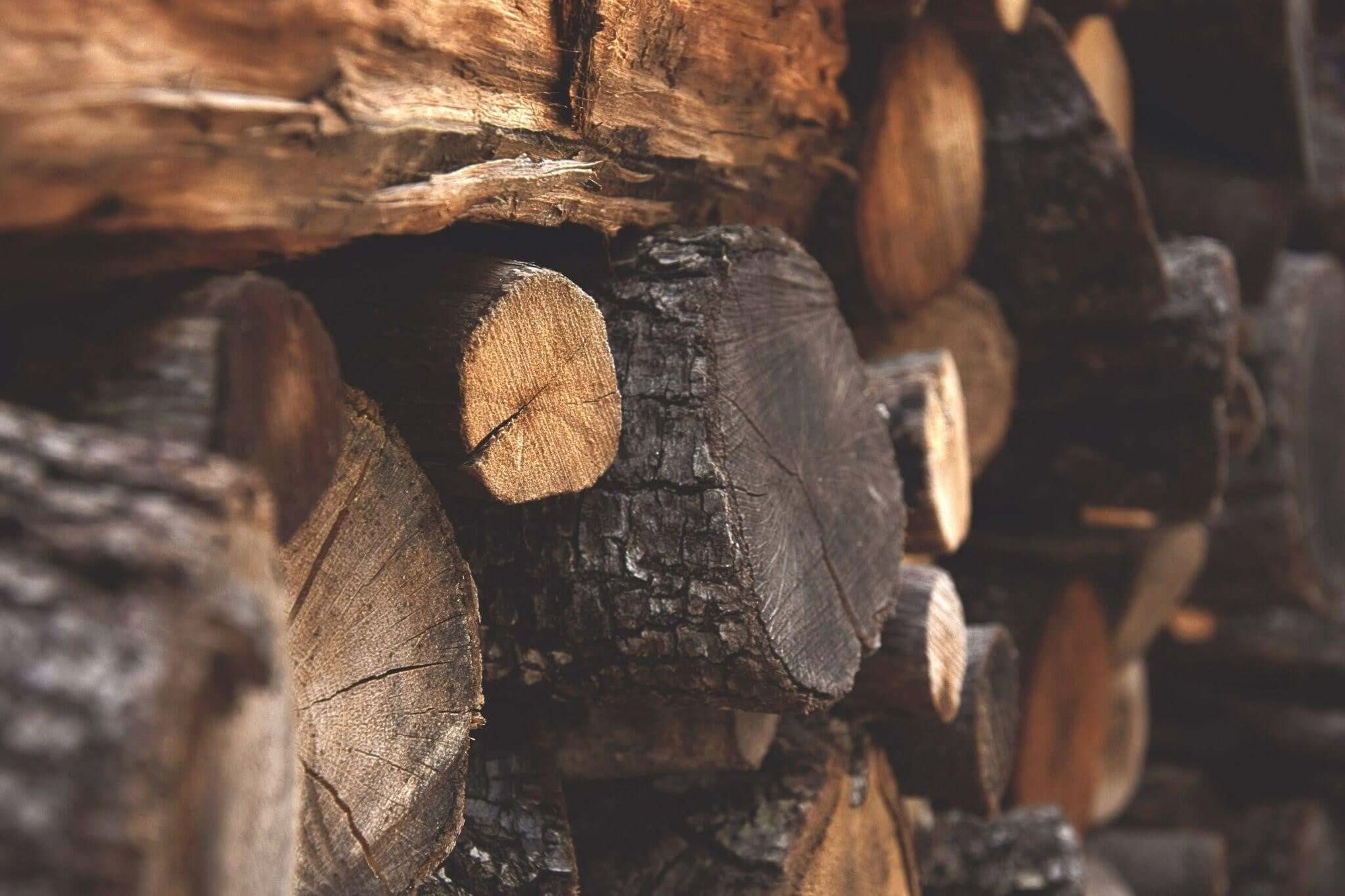 Wooden logs stacked together.