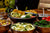 A table covered in bowls of various vegetable dishes.