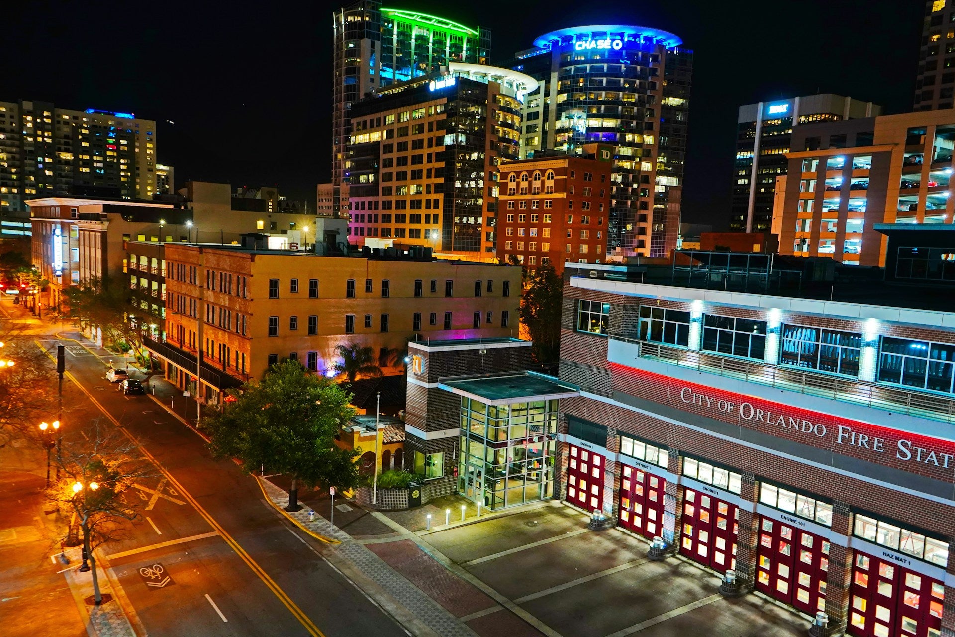 Orlando, Florida, at night. A sky view of the city's fire station, lit up.