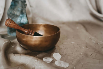 A singing bowl and quarts crystals.