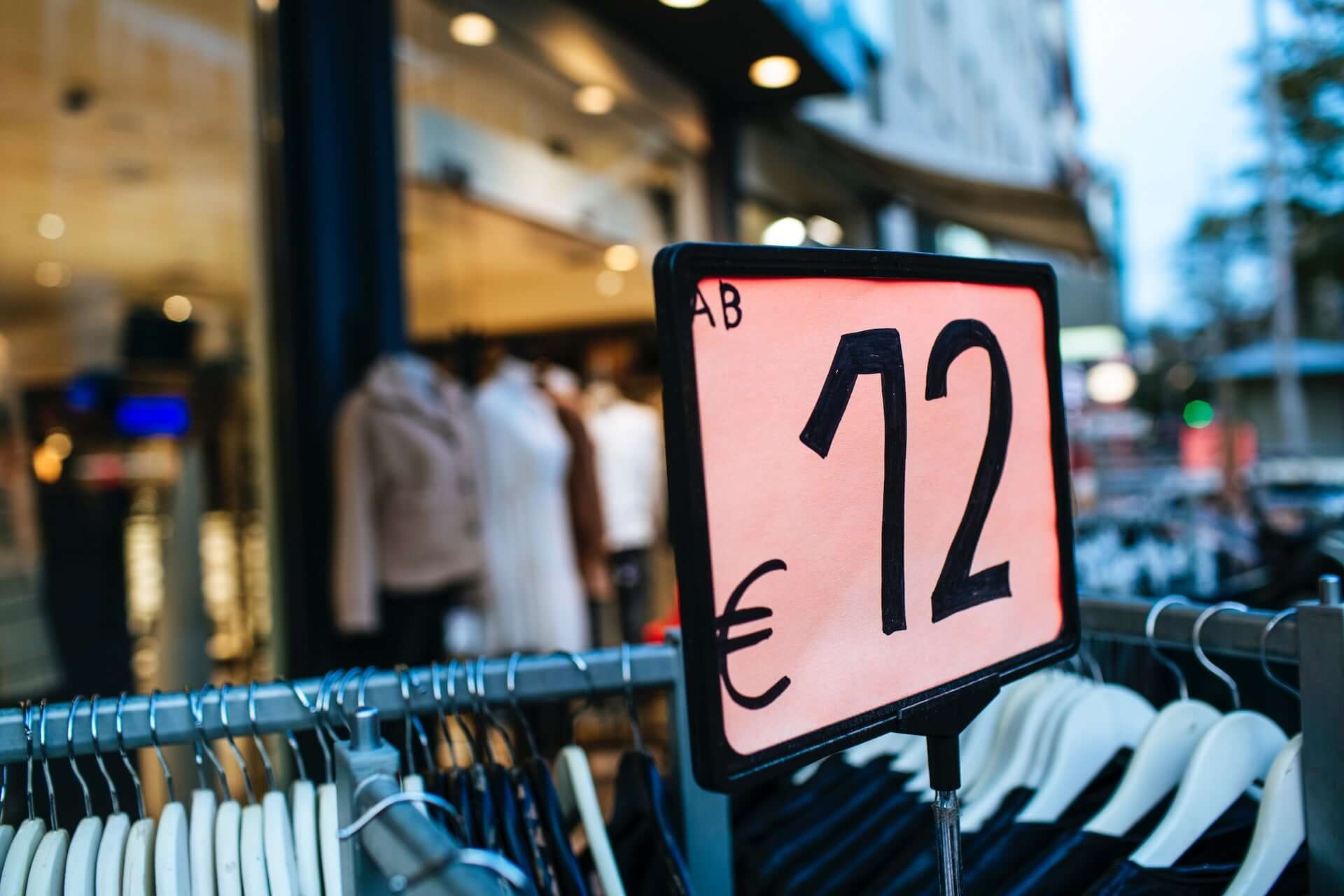 A sign for 12 euro clothing outside of a store.