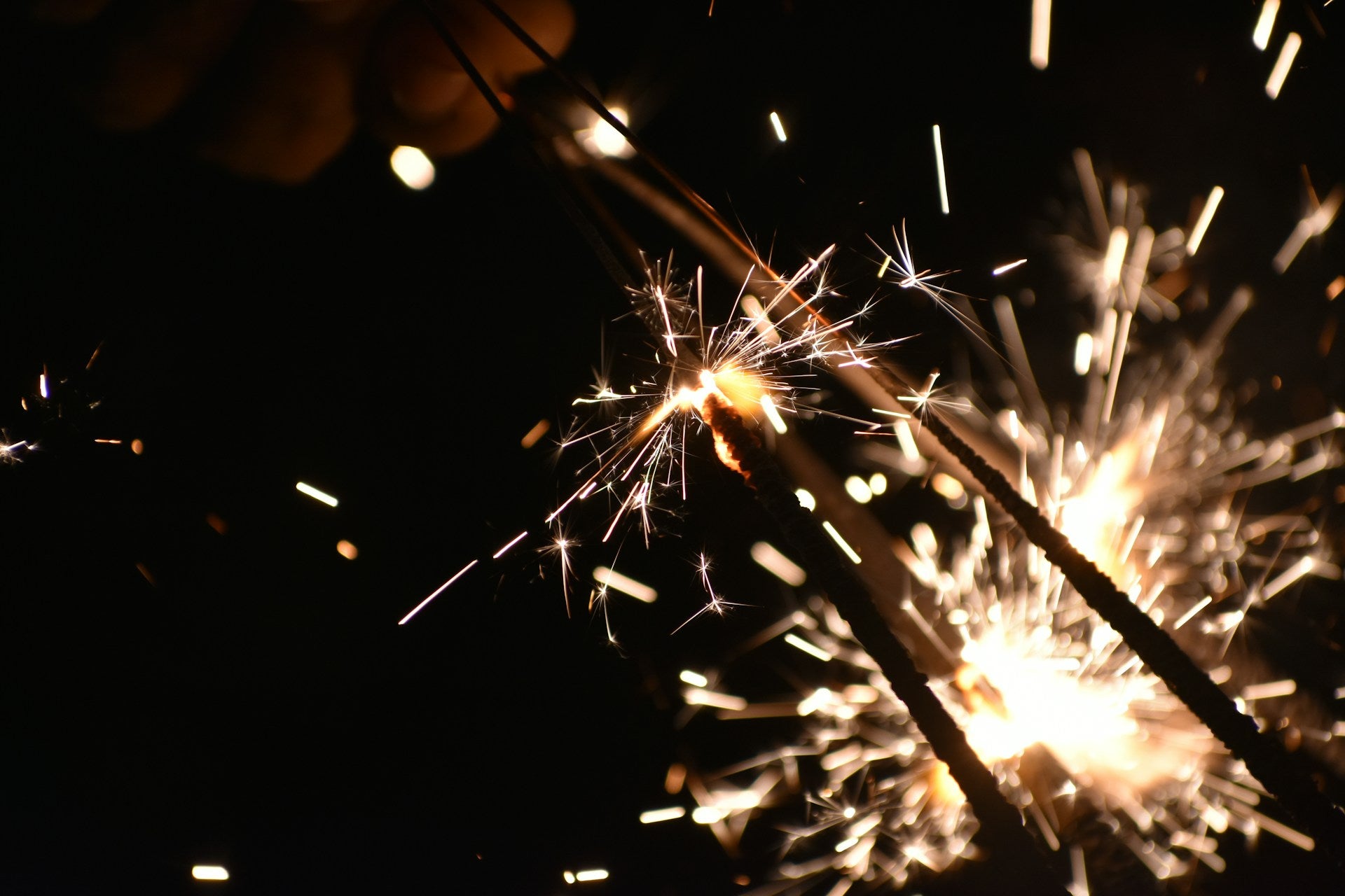 Sparklers glowing in the dark.