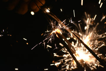 Sparklers glowing in the dark.