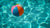 A colorful beach ball floating in pool water.